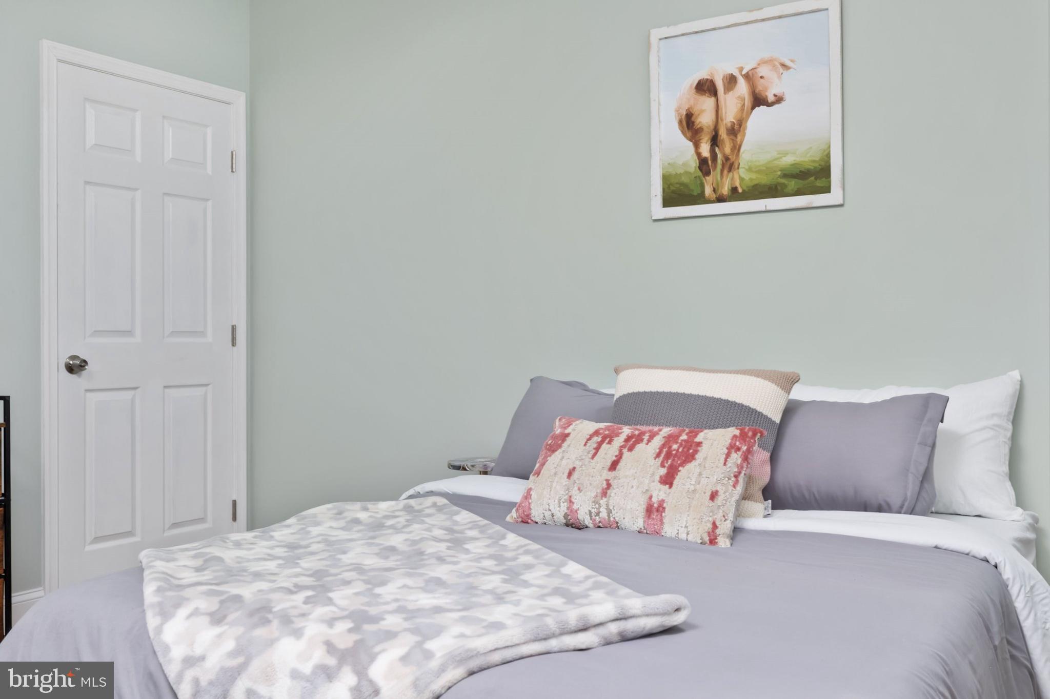 1195 Mountain View Drive Rileyville, VA 22650 - Photo 22 of 35 a bedroom with a bed and a painting on the wall