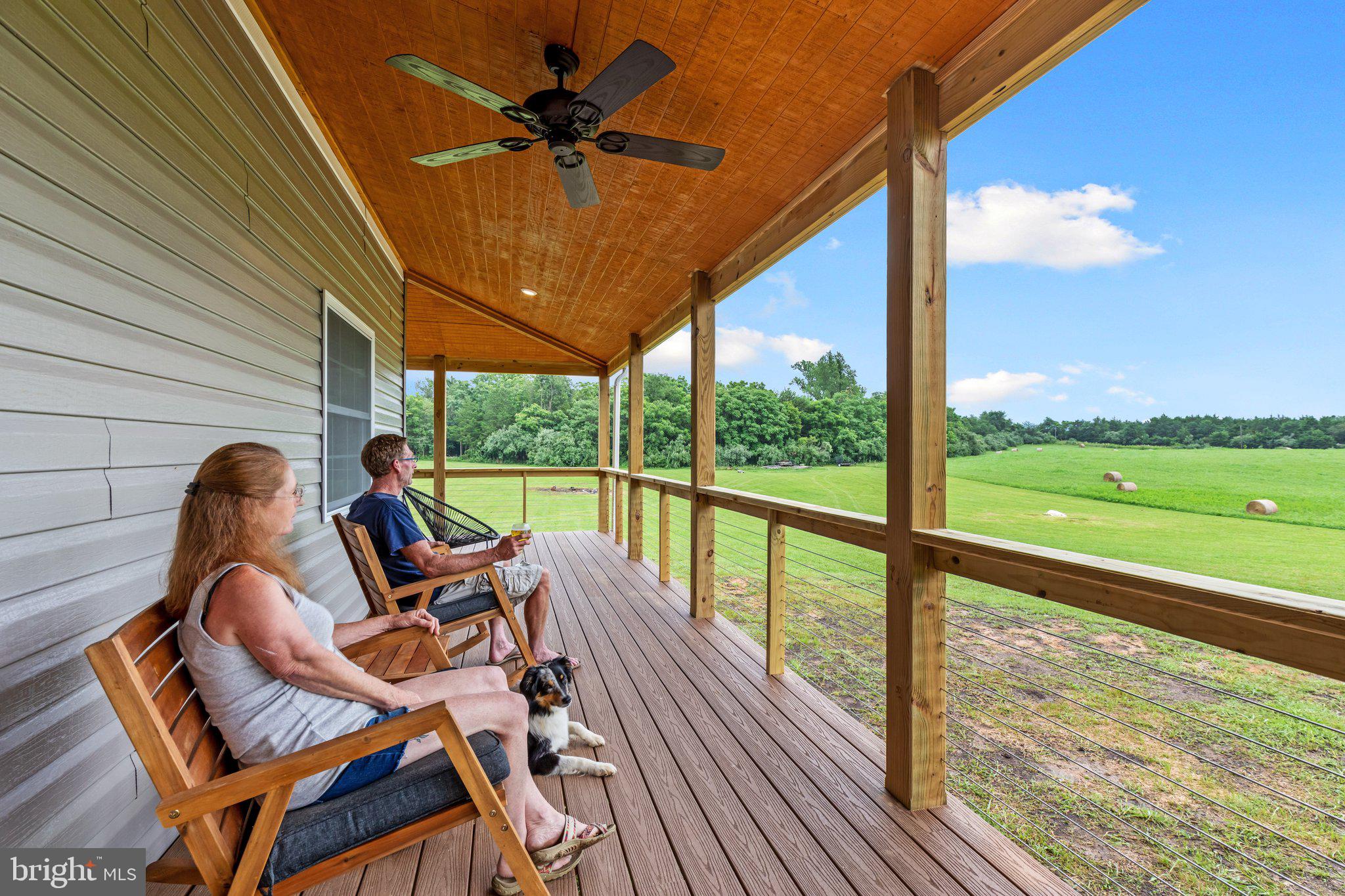 1195 Mountain View Drive Rileyville, VA 22650 - Photo 26 of 35 a roof deck with table and chairs and wooden floor