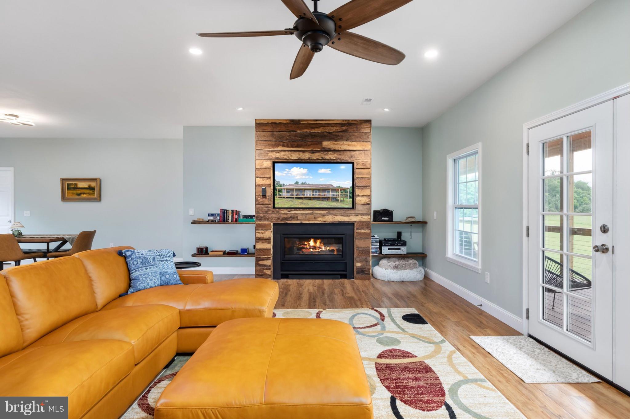 1195 Mountain View Drive Rileyville, VA 22650 - Photo 5 of 35 a living room with furniture and a fireplace