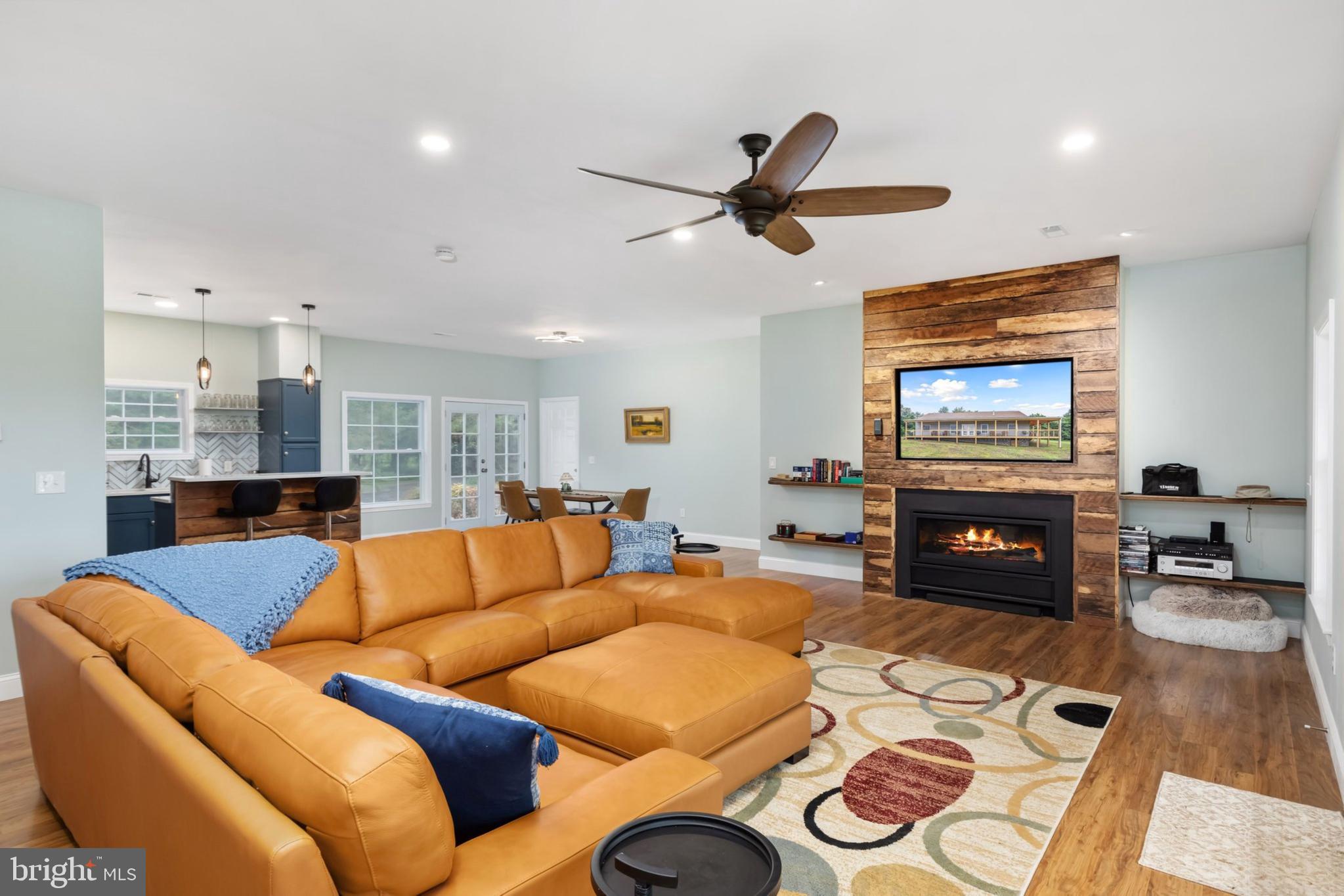 1195 Mountain View Drive Rileyville, VA 22650 - Photo 6 of 35 a living room with furniture and a flat screen tv with wooden floor