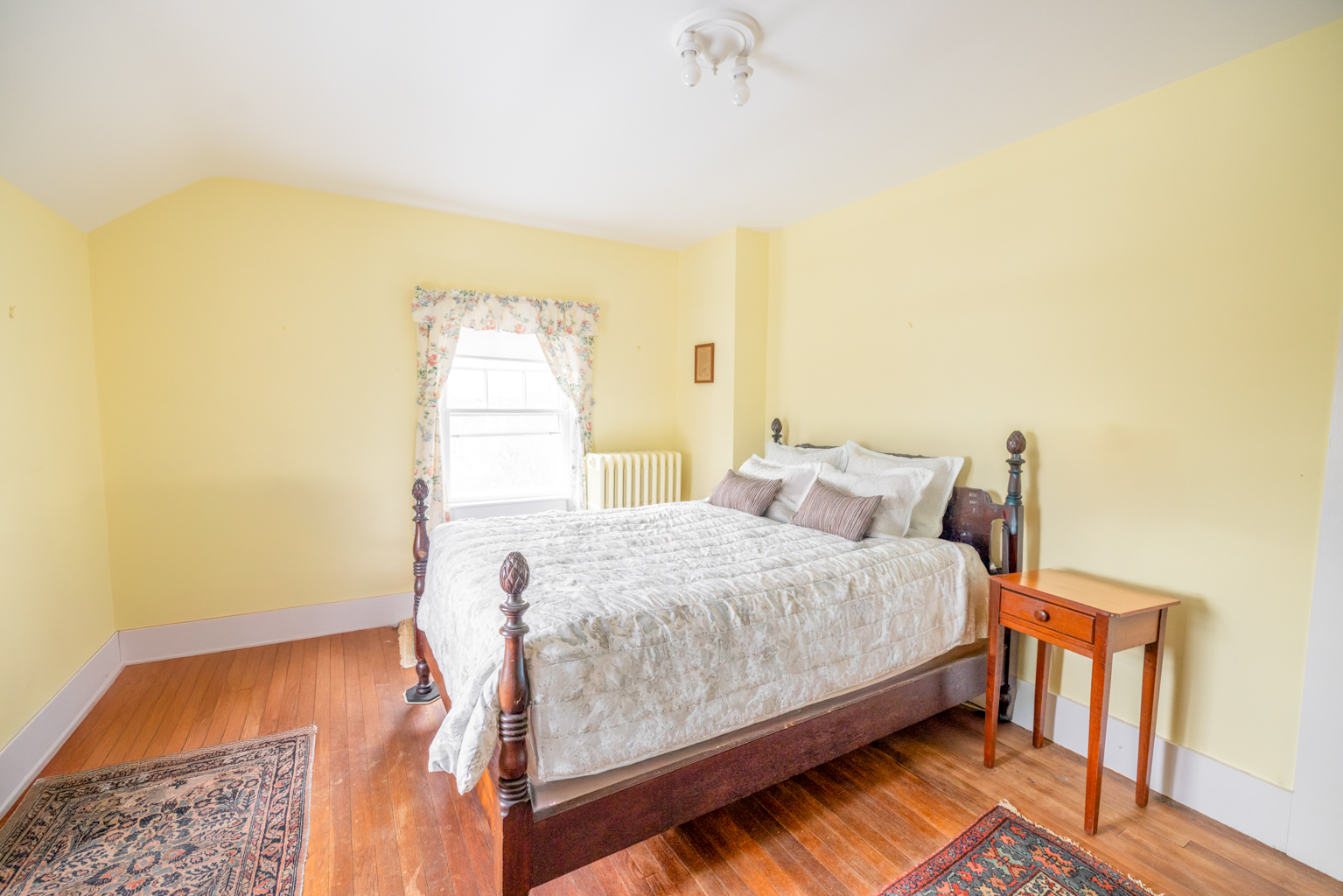35 West Chester Street Nantucket, MA 02554 - Photo 8 of 14 a bedroom with a bed and wooden floor