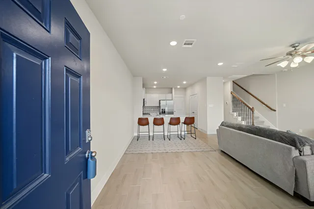 a living room with furniture and a table