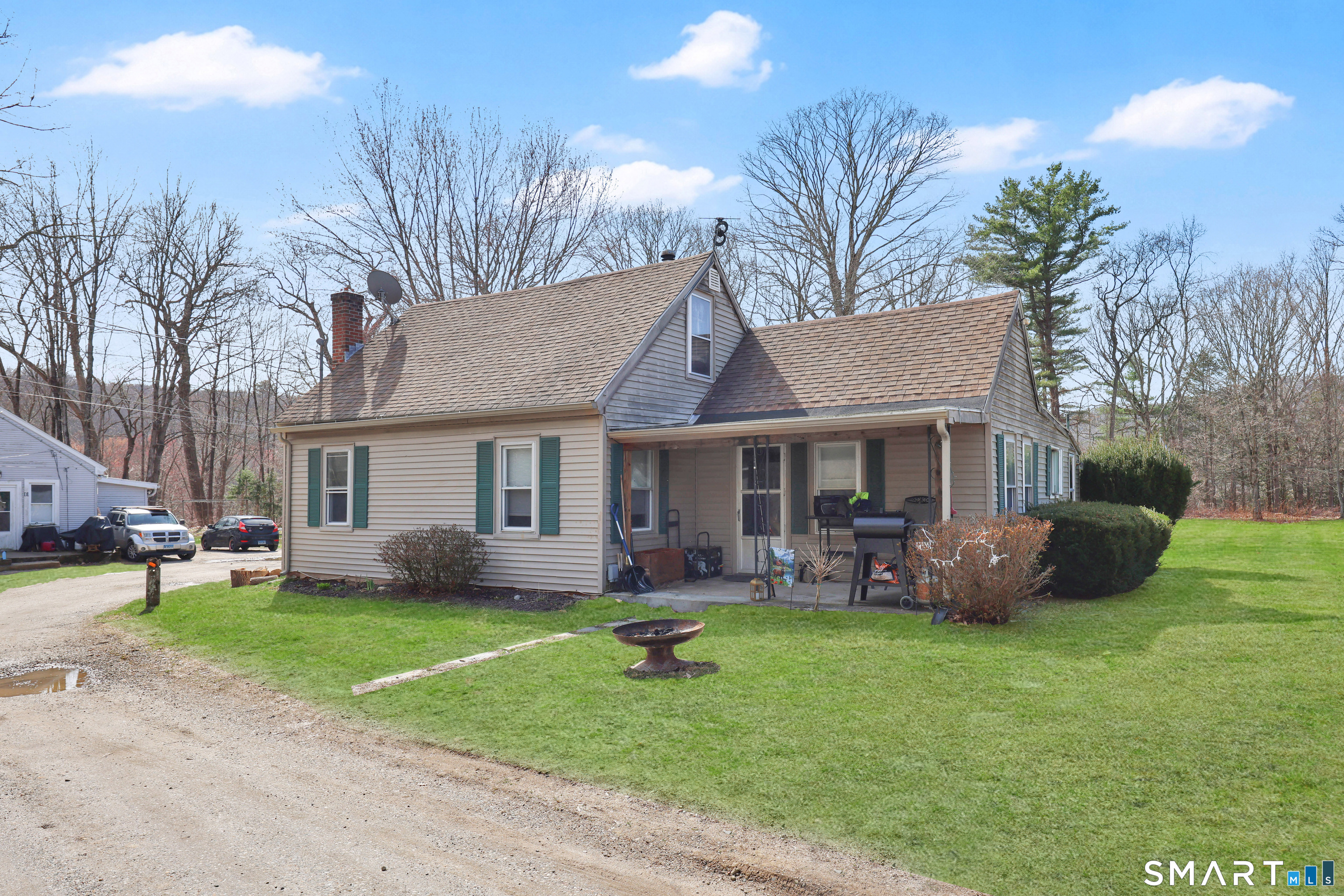 111 Depot Road Mansfield, CT 06268 - Photo 4 of 7 a view of a house with a yard porch and sitting area