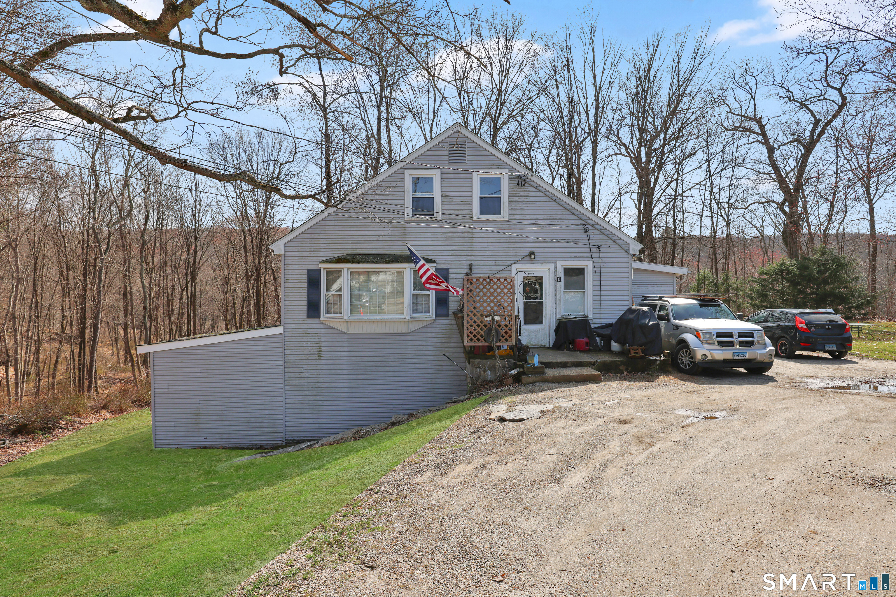 111 Depot Road Mansfield, CT 06268 - Photo 6 of 7 a view of a house with a patio and a yard