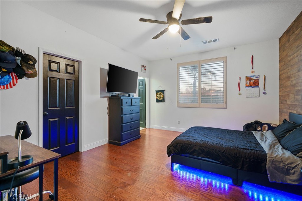 18604 Sunset Knoll Drive Riverside, CA 92504 - Photo 21 of 66 a living room with furniture and a flat screen tv