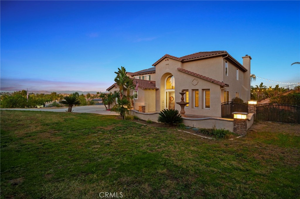18604 Sunset Knoll Drive Riverside, CA 92504 - Photo 44 of 66 a front view of a house with a yard