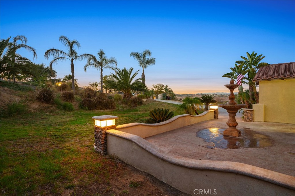 18604 Sunset Knoll Drive Riverside, CA 92504 - Photo 45 of 66 a view of a swimming pool with a table and chairs