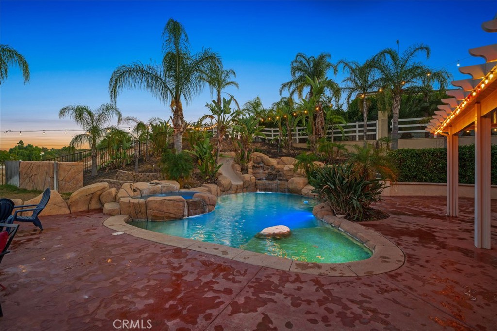 18604 Sunset Knoll Drive Riverside, CA 92504 - Photo 49 of 66 a view of backyard with swimming pool and outdoor seating