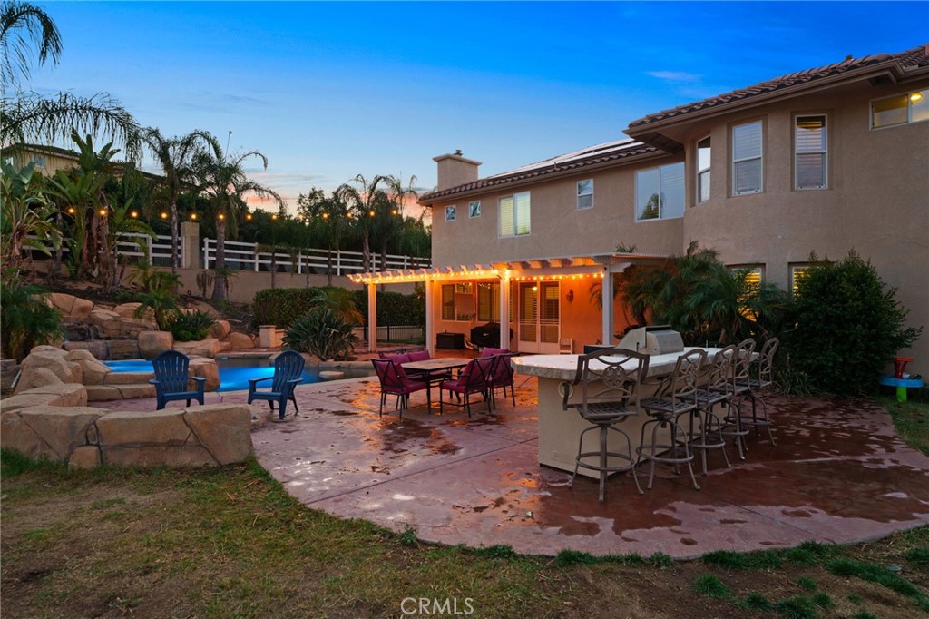 18604 Sunset Knoll Drive Riverside, CA 92504 - Photo 51 of 66 a view of a house with backyard sitting area and garden