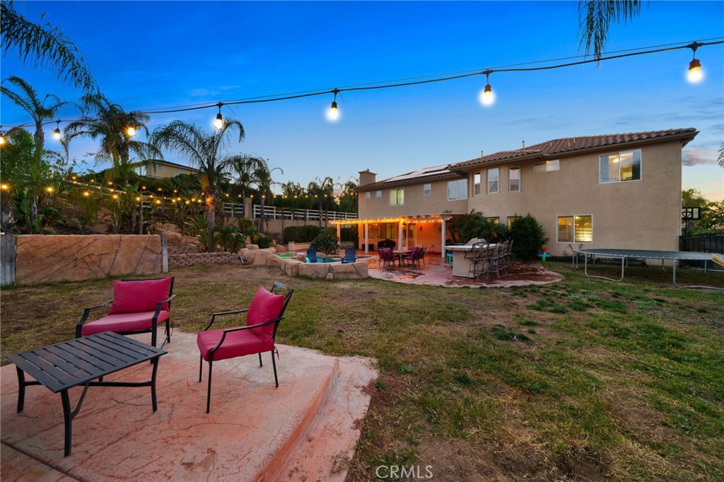 18604 Sunset Knoll Drive Riverside, CA 92504 - Photo 54 of 66 a view of a chairs and tables in the patio