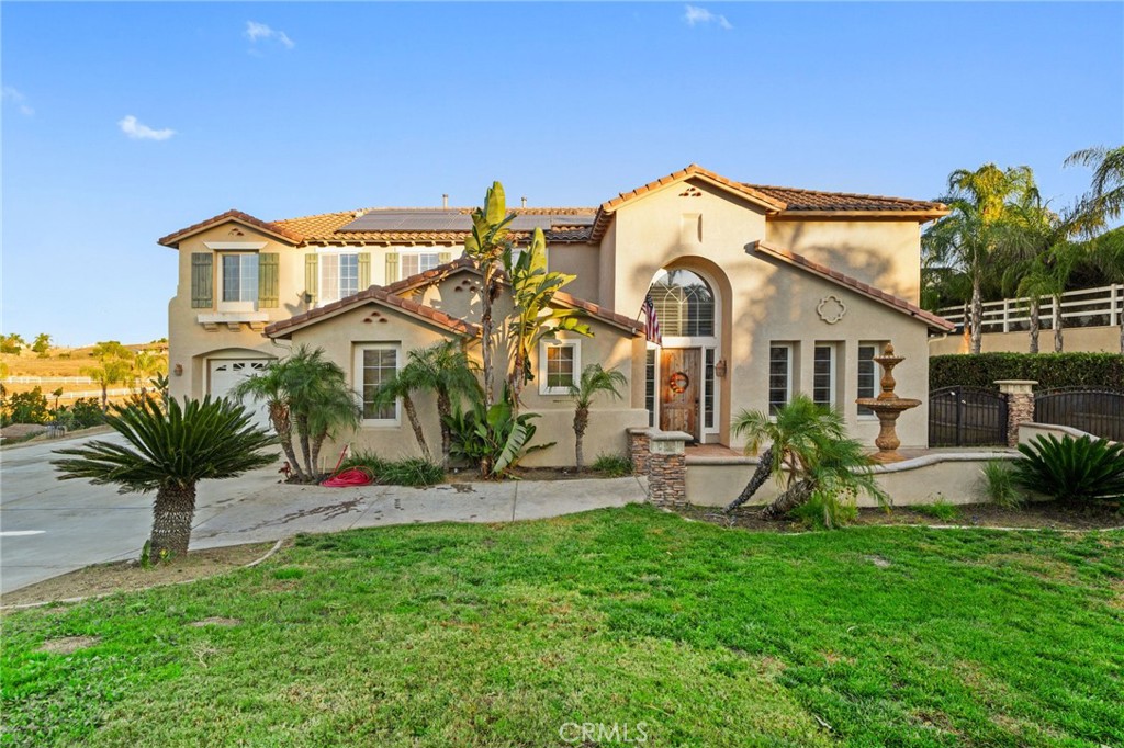 18604 Sunset Knoll Drive Riverside, CA 92504 - Photo 55 of 66 a view of a house with a yard and a large tree