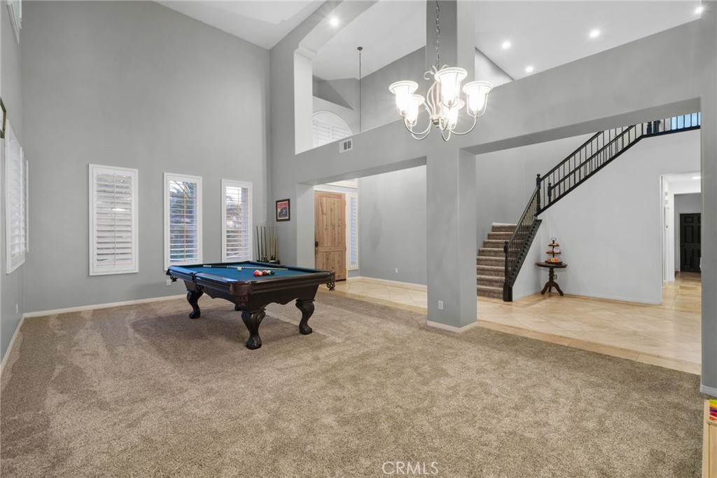 18604 Sunset Knoll Drive Riverside, CA 92504 - Photo 6 of 66 a view of a room with stairs and wooden floor