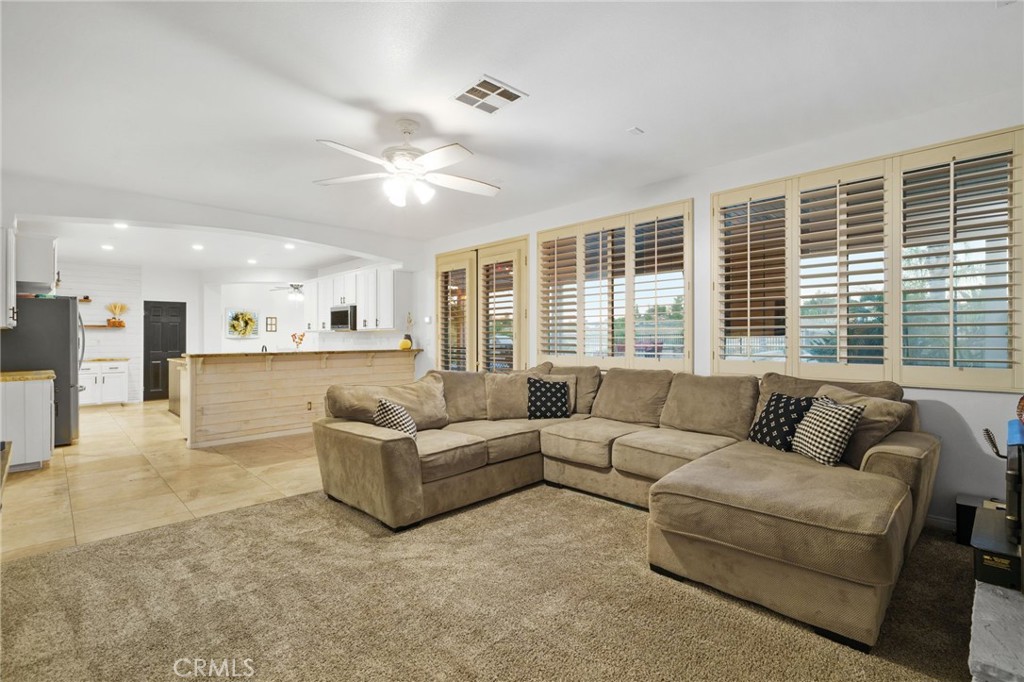 18604 Sunset Knoll Drive Riverside, CA 92504 - Photo 66 of 66 a living room with furniture and large windows