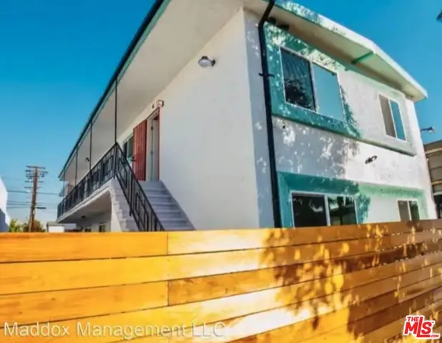 a view of swimming pool with a house