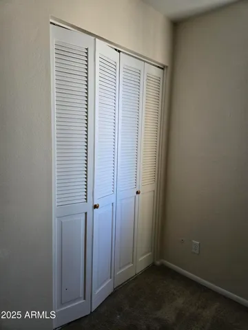 an empty room with a wooden door