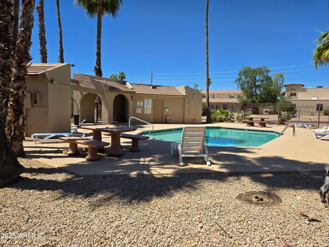 a view of garage with a car parked in it