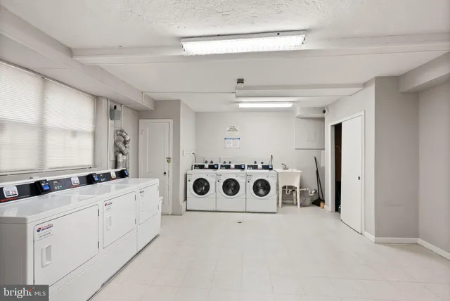 a bathroom with a double vanity sink and mirror
