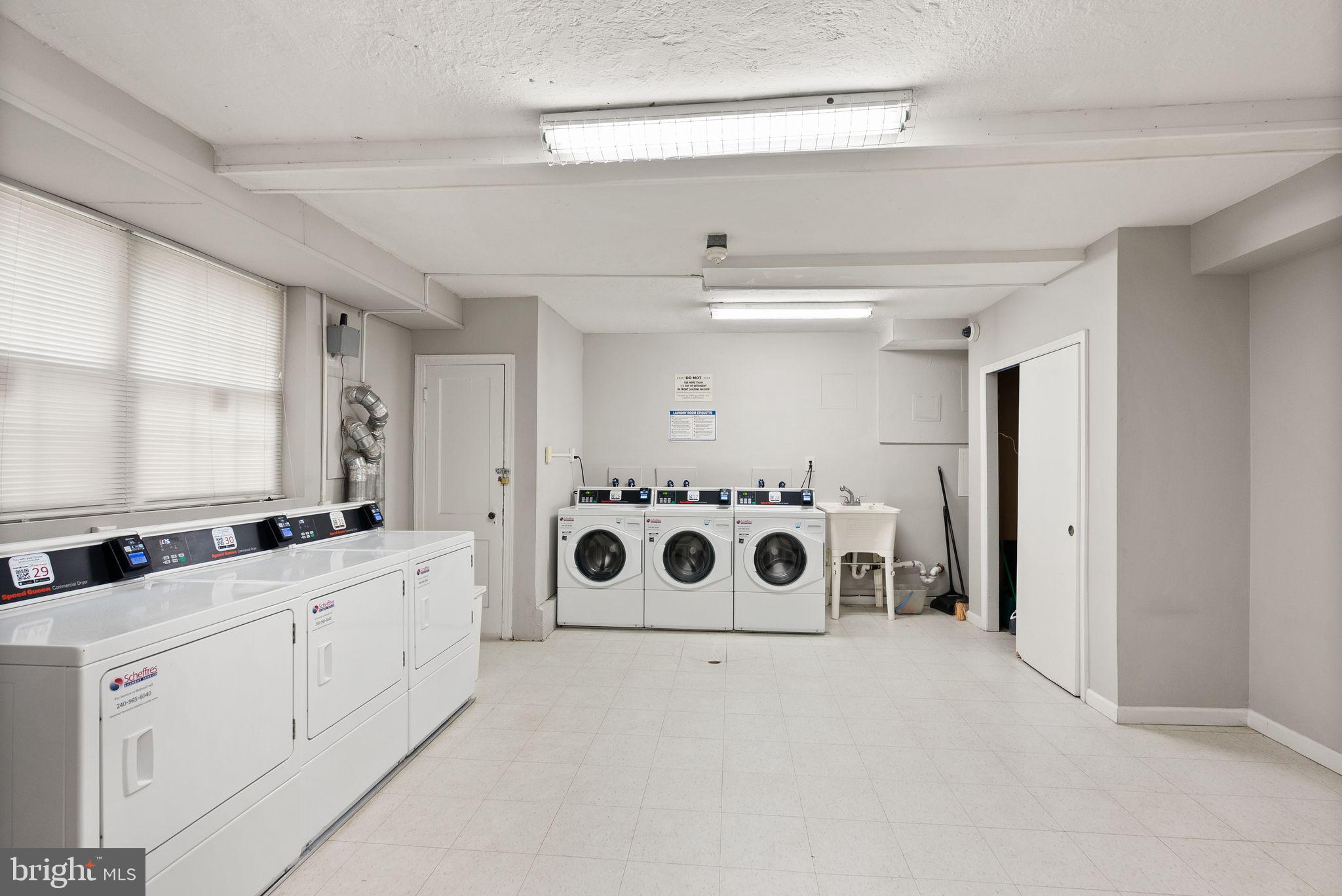 939 Longfellow Street Northwest, Unit 305 Washington, DC 20011 - Photo 15 of 17 a bathroom with a double vanity sink and mirror