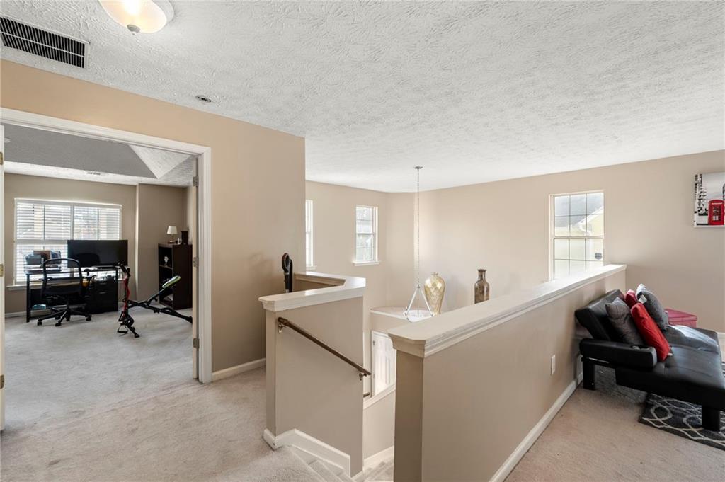 905 Ahearn Court Suwanee, GA 30024 - Photo 16 of 26 a workspace with furniture and window
