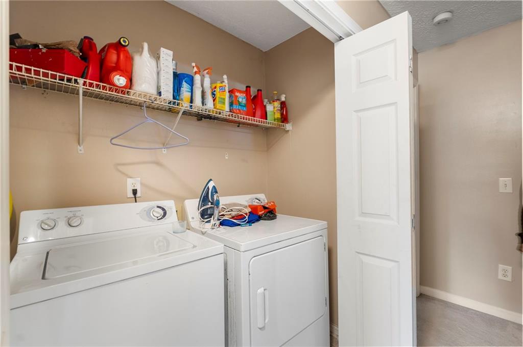 905 Ahearn Court Suwanee, GA 30024 - Photo 21 of 26 a utility room with dryer washer and a dishwasher