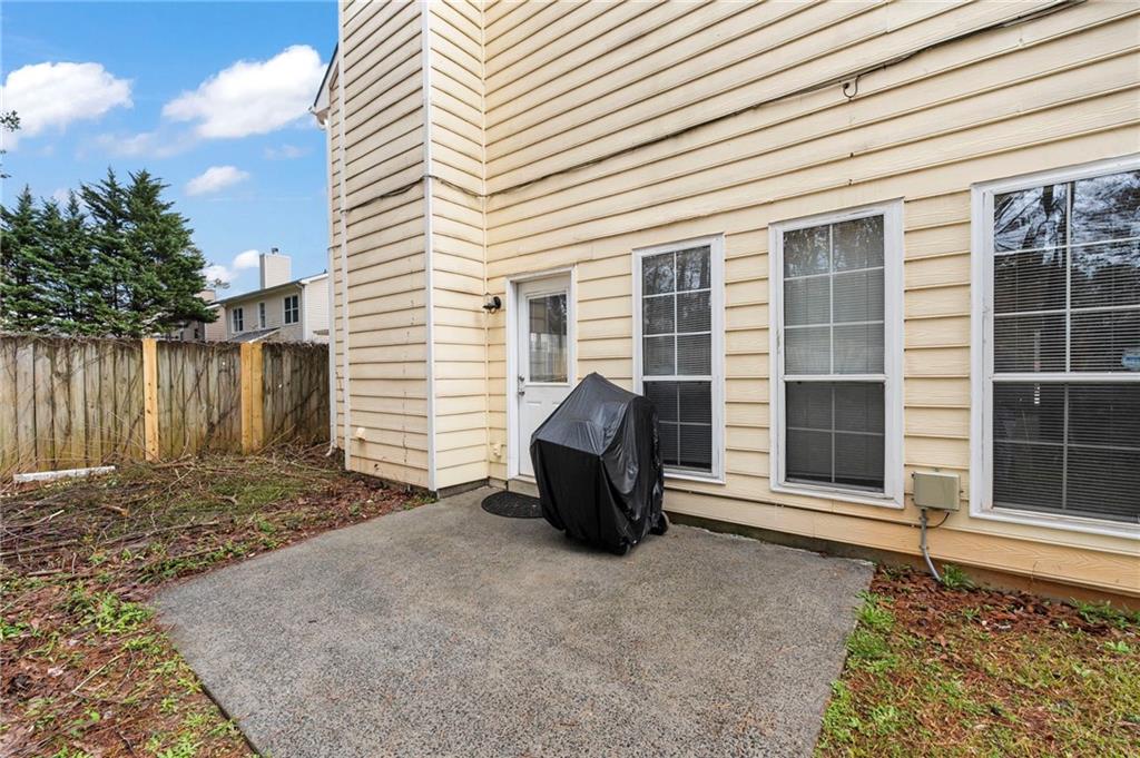 905 Ahearn Court Suwanee, GA 30024 - Photo 26 of 26 a house view with a backyard