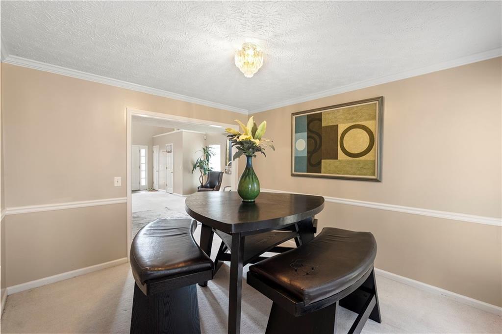 905 Ahearn Court Suwanee, GA 30024 - Photo 7 of 26 a living room with furniture and a window