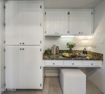 a kitchen with stainless steel appliances granite countertop a sink and a stove
