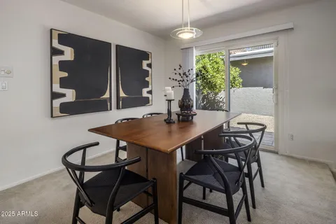 a bathroom with a granite countertop double vanity sink and a mirror