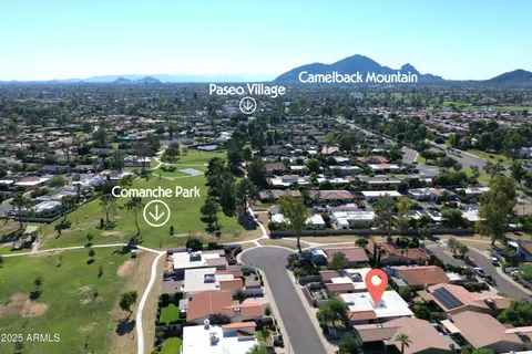 a living room with furniture a window and a flat screen tv