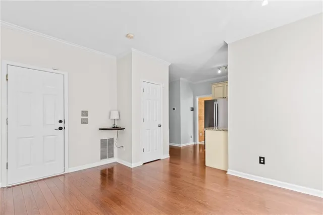 wooden floor with white walls