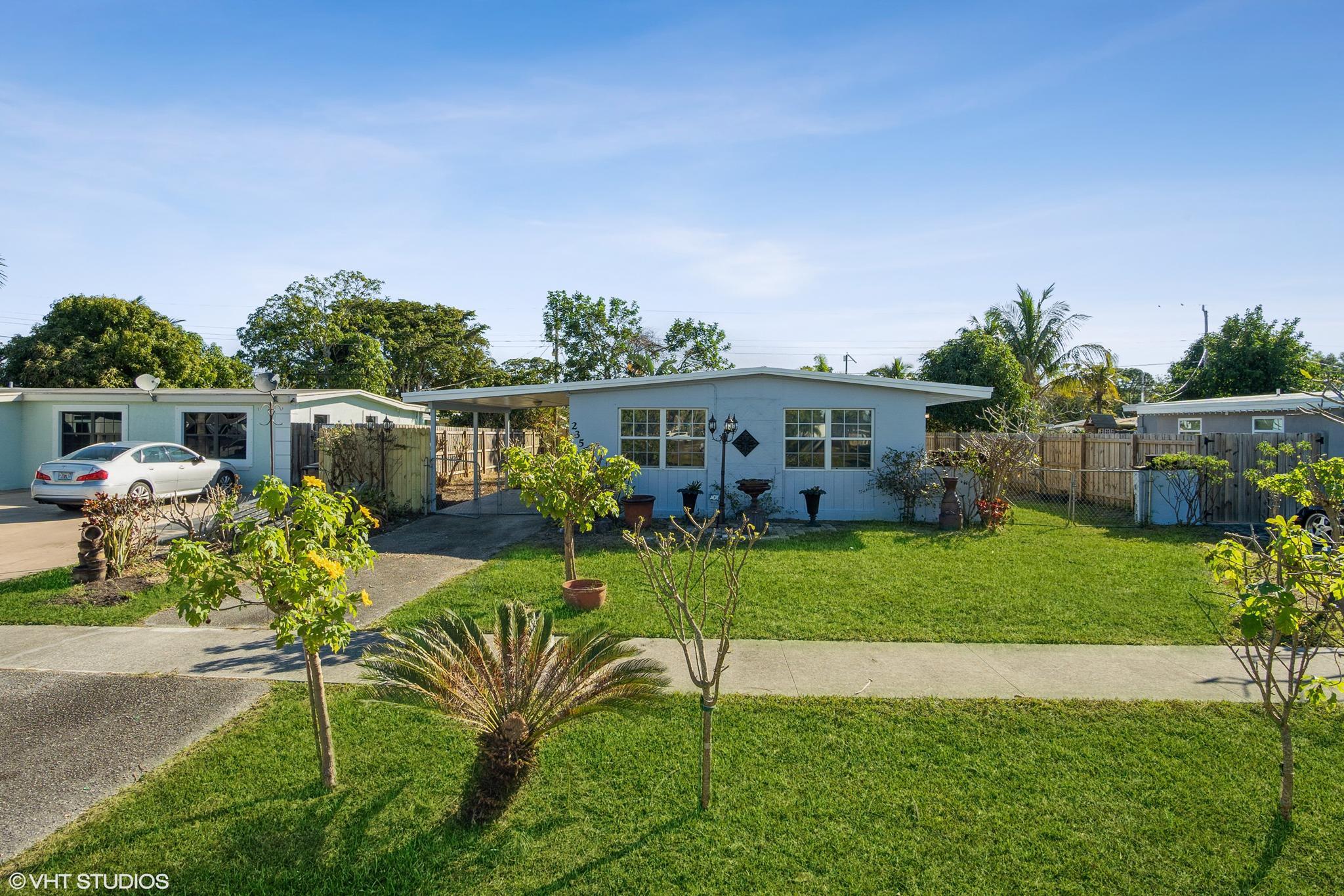 2356 Rue Road West Palm Beach, FL 33415 - Photo 3 of 26 03_2356RueRoad_572_FrontView_HiRes