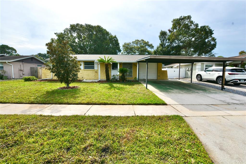 7911 Woodvine Circle, Tampa, FL 33615 Compass