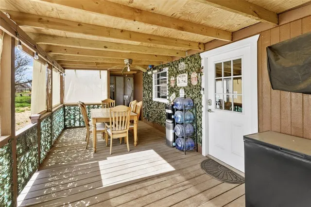 a living room with furniture and a kitchen