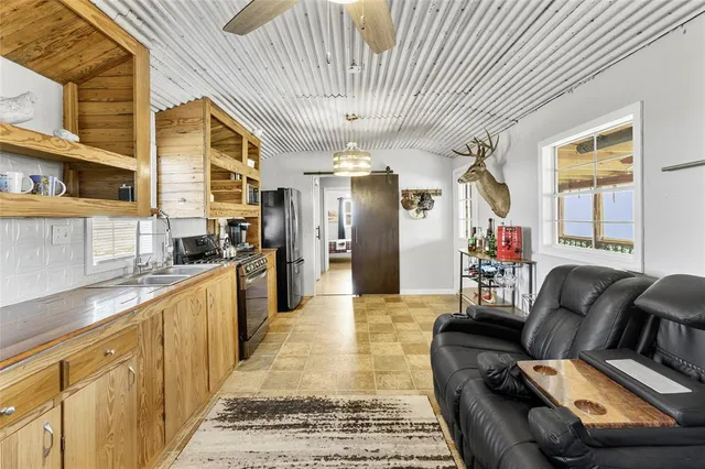 a kitchen with stainless steel appliances granite countertop a stove and a sink