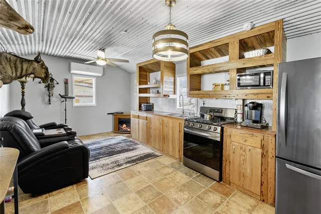 a kitchen that has a sink and a stove
