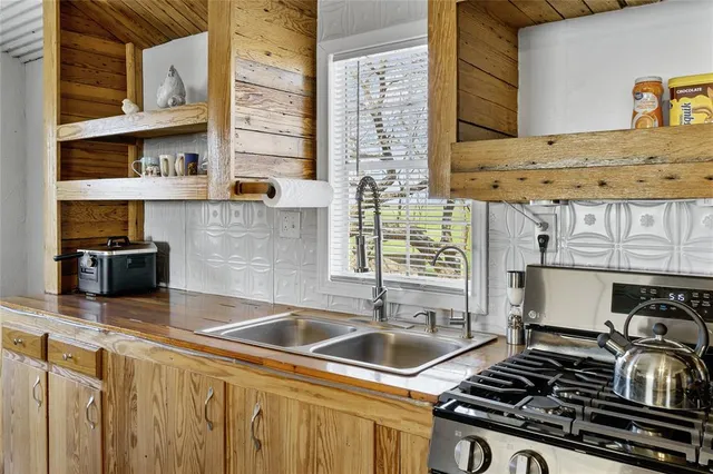 a bedroom with a bed and wall painting