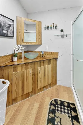 a view of a bedroom with furniture and closet