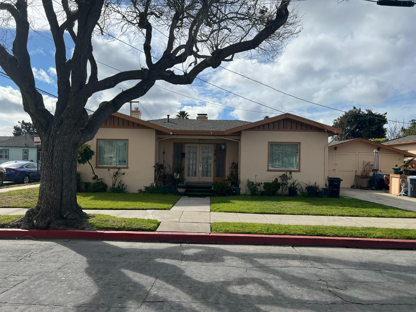 52 West Street Salinas, CA 93901 - Photo 1 of 6 a front view of a house with a yard table and chairs
