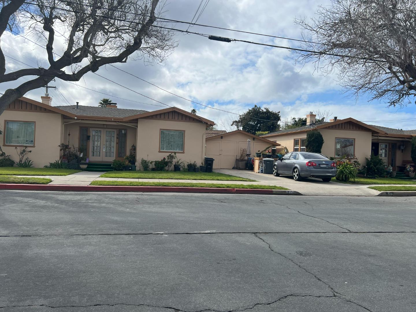 52 West Street Salinas, CA 93901 - Photo 2 of 6 a front view of a house with a big yard and potted plants