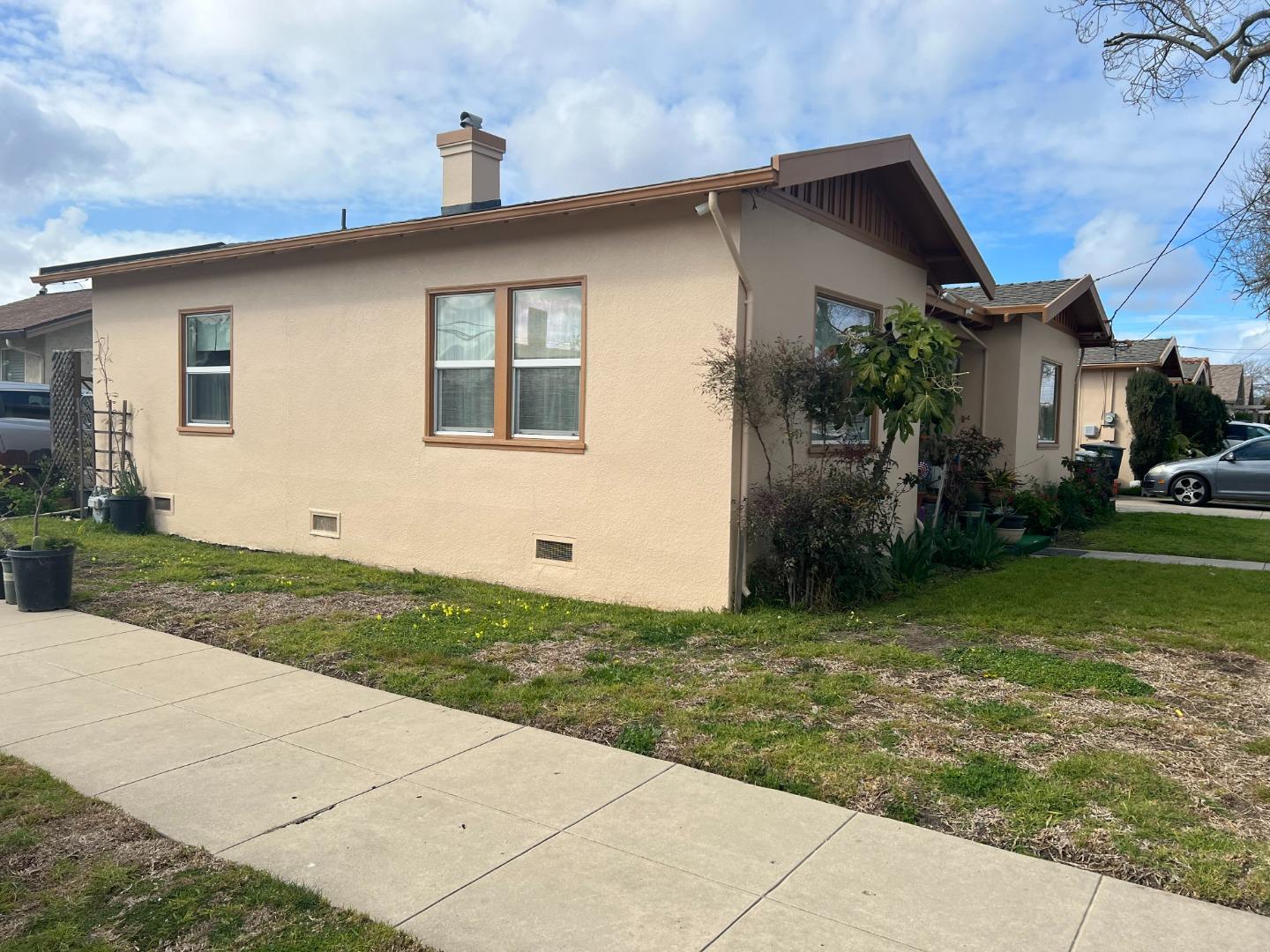 52 West Street Salinas, CA 93901 - Photo 4 of 6 a backyard of a house with potted plants