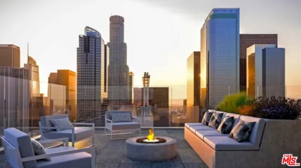 a outdoor living space with furniture and a potted plant