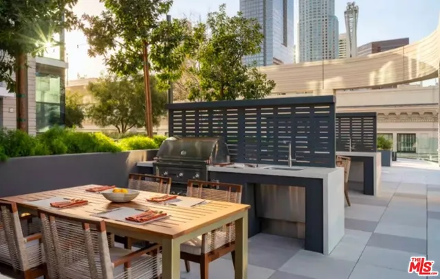 a swimming pool view with a outdoor seating