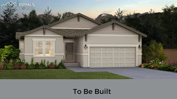 a view of a house with a small yard and plants