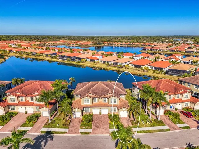 an aerial view of residential houses with outdoor space
