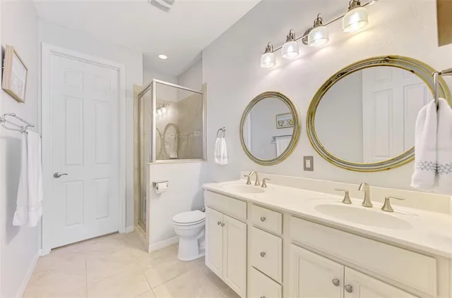 a view of a house with swimming pool lawn chairs and a yard