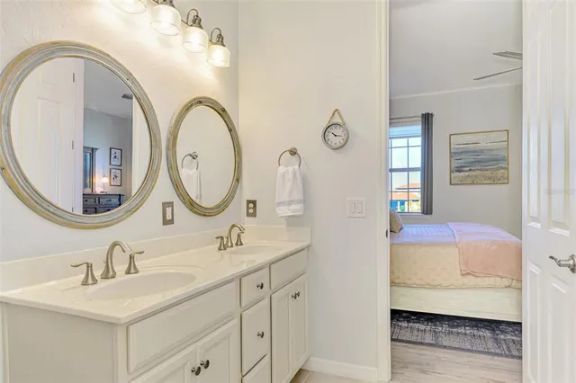 an aerial view of a house with swimming pool patio and lake view