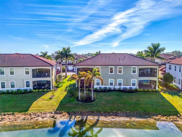 an aerial view of a house with outdoor space pool seating area and yard