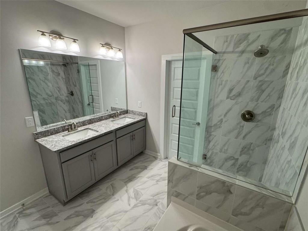 2530 Harbor Ridge Gainesville, GA 30507 - Photo 14 of 44 a bathroom with a double vanity sink mirror and shower