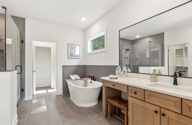 a view of a bathroom with a sink and mirror