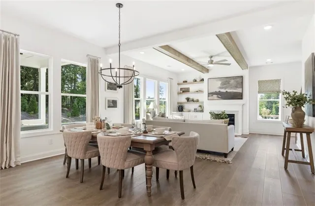 a view of a dining room with furniture window and wooden floor